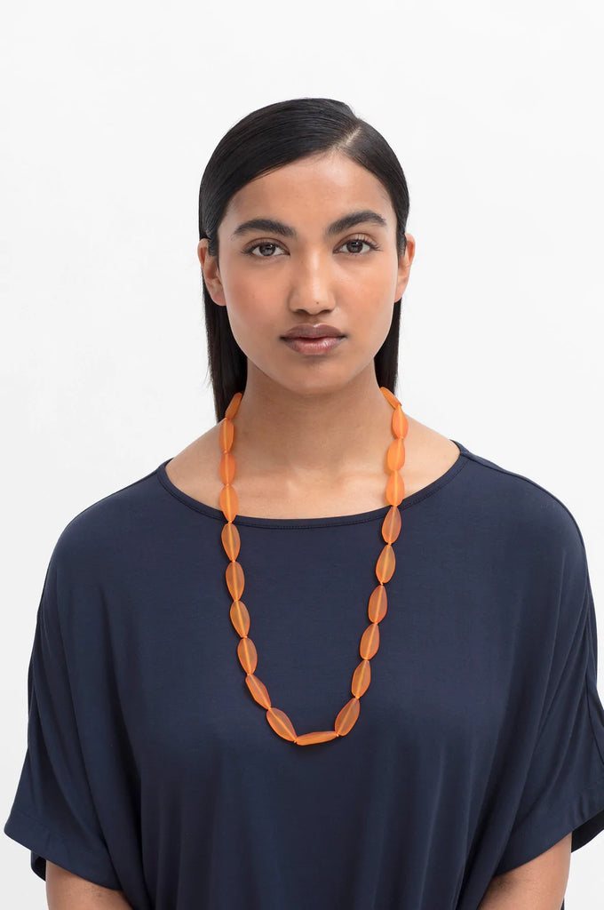 Woman wearing Elk Lias Frosted Necklace tumeric